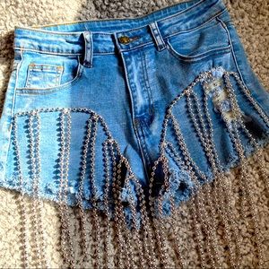 Jean shorts with Mardi Gras beads.